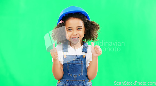 Image of Little girl, thumbs up and construction with safety helmet on green screen for good job against a studio background. Portrait of architect kid showing thumb emoji, yes or like for success on mockup