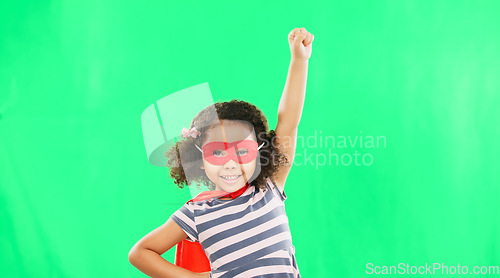 Image of Child, superhero and hand to fly on green screen to stop crime and fight with fantasy or cosplay costume. Girl power, hero and game with smile of strong kid portrait to protect freedom and justice