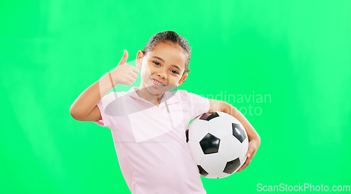 Image of Girl, soccer ball and thumbs up in green screen studio with smile, face and happiness in sport mockup. Young female child, football mock up and happy for kids sport agreement, portrait and training