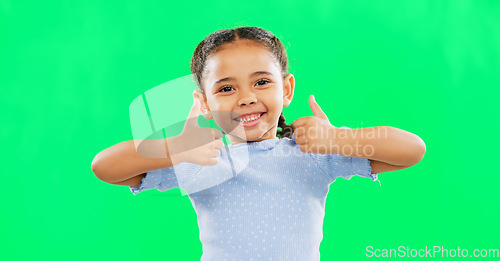 Image of Thumbs up, happy and child in agreement excited, winning and girl kid isolated in studio green screen background. Yes, approval and portrait of young person with yes hands, gesture or sign