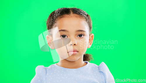 Image of Eyebrow raise, green screen and child face of a young girl with a funny, meme and emoji expression. Comic, kid and humor of a little kid with isolated studio background with youth comedy and alone