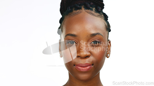 Image of Face, smile with a black woman in studio isolated on a white background for fun or humor. Portrait, happy and smiling with an attractive young female enjoying a joke or funny meme