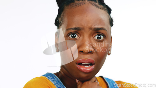 Image of Face, fear, shocked, concerned and worried with a black woman in studio isolated on a white background looking afraid. Portrait, scared with a young female feeling alone, helpless or overwhelmed by e