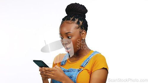 Image of Smile, typing and happy black woman with phone on white background for funny meme, humor and comic text. Communication, social media and girl laugh on smartphone for news, surprise and shocked face