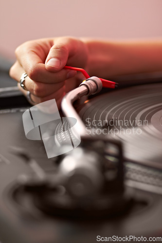 Image of Closeup, dj hand and vintage turntable with vinyl, music system and needle for sound job, party or audio gear. Person, retro record player and disc for scratch, spinning and listening in club in zoom