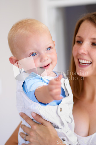 Image of Happiness, love and curious baby with woman, growth and development in early childhood and family with care. Young mother, toddler and smile, parenting and bonding with motherhood and cute kid