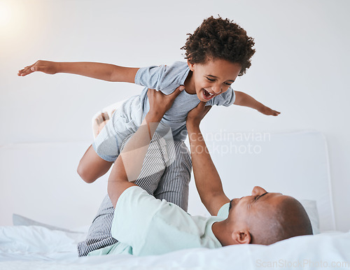 Image of Airplane, playful and father with son in bedroom for morning, wake up and weekend. Happy, excited and funny with man and young child playing in family home for happiness, freedom and support