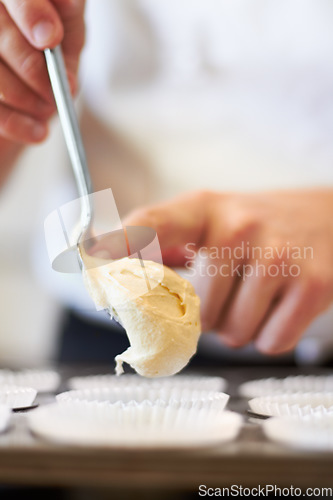 Image of Closeup, hands and cupcake dough in tray with baker, small business owner and professional chef. Cooking, bakery and cake in baking pan for food, job and start process for muffins in shop kitchen