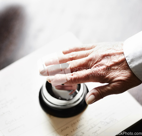 Image of Bell, ring and person hands for hospitality, customer services and receptionist desk for information. Senior help, support and elderly people press sound for attention, registration and hotel booking