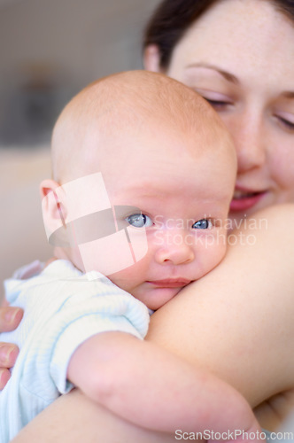 Image of Portrait, child and mother holding baby, bonding and care together in home. Face, kid and mom carrying newborn, infant or young toddler, playing and enjoying quality time with love, family and happy.