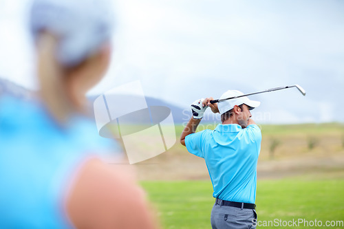 Image of Drive, man or golfer playing golf for fitness, workout or exercise to swing or drive on green course. Woman blur, person golfing or athlete training in action or sports game driving with club stroke