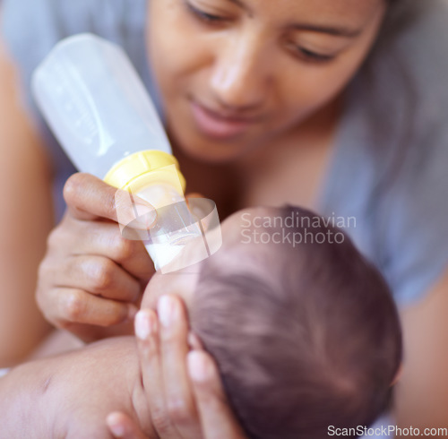 Image of Mom, baby and feeding milk from bottle for nutrition, health and wellness. Formula, newborn and mother feed child for early childhood development, growth and healthy diet, food and lunch at home.