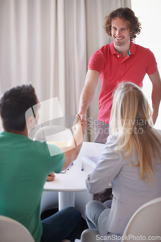 Image of Man, interview and shaking hands in meeting for a job, recruitment and hiring opportunity for a worker or employee. People, handshake and business internship application or happy conversation with hr