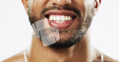 Image of Dental, teeth and smile of Indian man in studio for beauty, cleaning and self care. Oral hygiene, natural and cosmetic treatment with male model isolated on white background for veneers, fresh or res