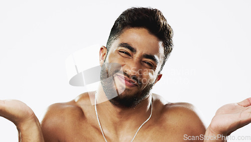 Image of Uncertain confused and face of man in studio for wellness, skincare and hygiene on white background. Doubt, portrait and indian male model with unsure shrugged shoulders contemplating beauty cosmetic