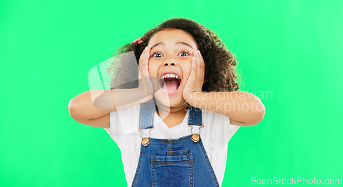 Image of Shocked, surprise and child hands on face screaming and excited, happy and winning isolated in a studio green screen background. Portrait, young and kid with surprised facial expression due to news