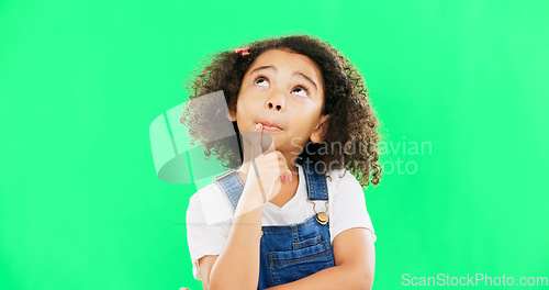 Image of Thinking, green screen and a child with a decision isolated on a studio background. Doubt, think and a confused girl kid looking thoughtful, contemplating and planning an idea with mockup space