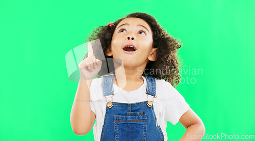 Image of Idea, thinking and child pointing up at mockup space or green screen isolated against a studio background. Portrait, cute and smart, clever and intelligent kid or young person for brand placement