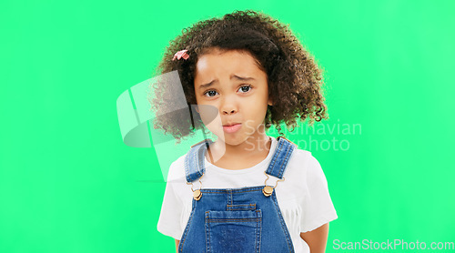 Image of Sad, unhappy and face of a child on a green screen isolated on a studio background. Trouble, crying and portrait of a girl kid on a backdrop with sadness, expression and emotion with mockup space