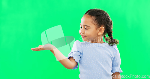 Image of Green screen, hand gesture and child face of a young girl with mock up showing advertisement or product. Portrait, smile and happiness of a little kid with isolated studio background with mockup