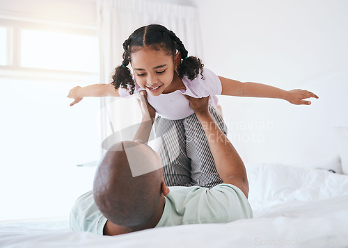 Image of Airplane, game and father with daughter in bedroom for morning, wake up and weekend. Happy, excited and funny with man and young girl playing in family home for happiness, freedom and support