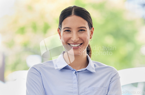 Image of Portrait, smile and a business woman administrator at work during the day on a green blurred background. Happy, confident and proud with an attractive young female employee standing outdoor alone