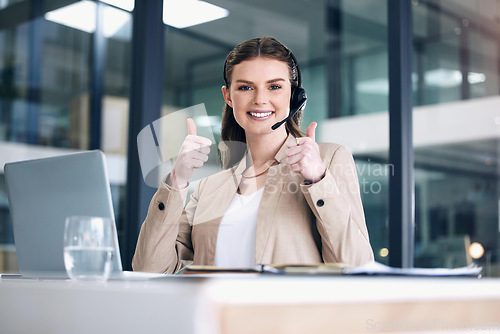 Image of Thank you, portrait of call center agent with thumbs up and headset at her office in a modern workplace. Telemarketing or customer service, online communication or consultant and female person happy