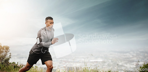Image of Man, running and space for fitness with cityscape for exercise, wellness or music with mockup for health. African male runner listening to audio for focus, workout and nature outdoor with mock up sky