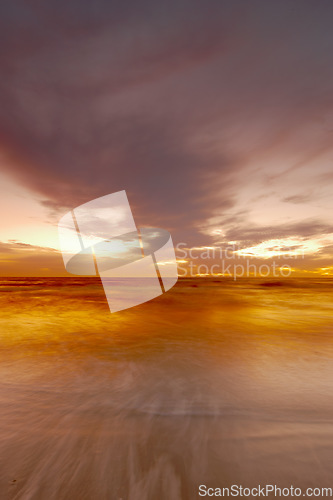 Image of Nature, ocean and clouds with sunset at beach for environment, peace and landscape mockup. Summer, sunshine and sunrise with wave on horizon for travel destination, reflection and seaside vacation