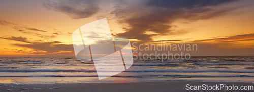 Image of Sky, sunset and sea at morning on the horizon with ocean and waves landscape. Sunrise, calm weather and summer by the beach with coastline and outdoor with the sun setting by water in nature