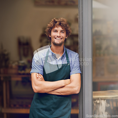 Image of Retail, arms crossed and portrait of man at restaurant for small business, coffee shop and waiter. Entrepreneur, happy and smile with male barista at front door of cafe for diner and food industry