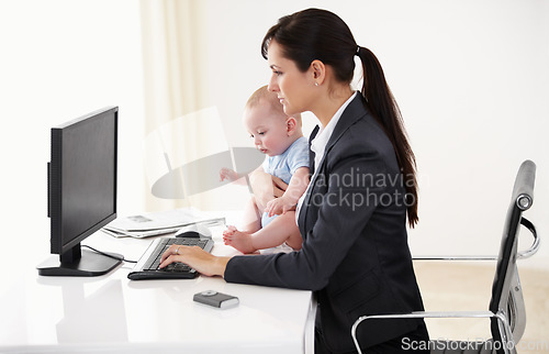 Image of Remote work, businesswoman with her baby and typing on keyboard with pc at her desk in a office. Technology, commitment and mother with her child writing an email with her computer at her home