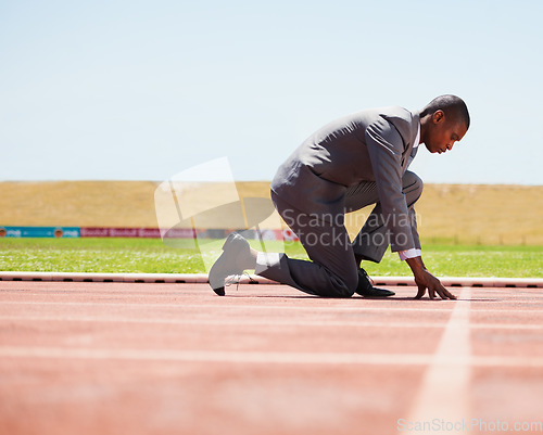 Image of Start, race track and man in a suit for sport, running and fitness, cardio and speed practice. Starting line, ready and formal male sports runner at a stadium for challenge, performance and workout