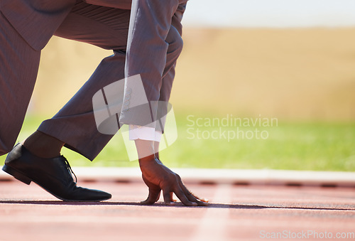 Image of Race track, start and man in a suit for sport, running and fitness, cardio and speed practice. Starting line, ready and formal male sports runner at a stadium for challenge, performance and workout