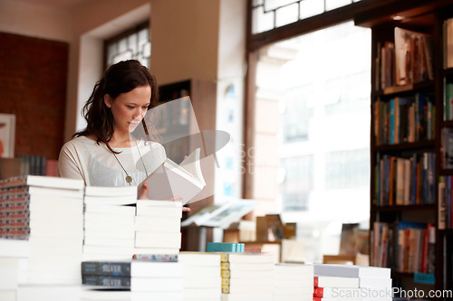 Image of Woman, books and reading in a store, library or bookstore customer and choosing a novel to buy, read or study. Girl, bookshelf and studying a book for college, university or research information