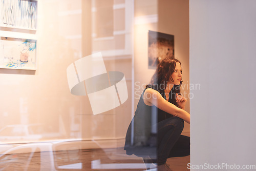 Image of Museum, art and a woman in a painting gallery, looking at photography exhibition in creative appreciation. Artwork, design and culture with an attractive young female at an expo or artistic exhibit