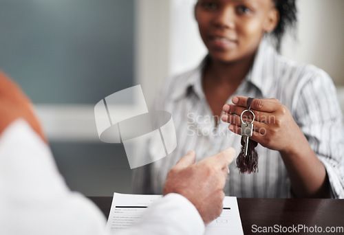 Image of Hotel, hospitality and a woman receptionist with keys at check in to help a tourist customer at a luxury resort. Welcome, travel and a female concierge in a lodge for assistance with accommodation