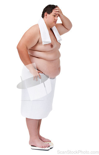 Image of Body, plus size and man on a scale in studio with stress or frustration after diet or exercise failure. Upset, weight loss and male person with towel weighing on machine isolated by white background.