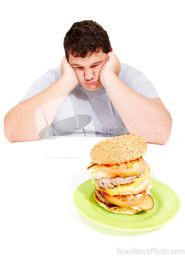 Image of Sad, plus sized and man with a burger meal in a studio for lunch, supper or dinner for weight gain. Depression, upset and male person with fast food with calories isolated by a white background