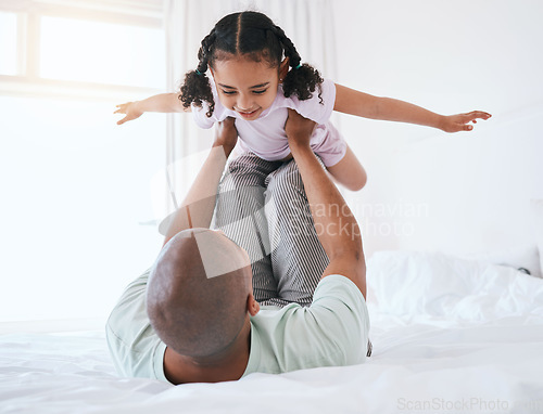 Image of Airplane, playful and father with daughter in bedroom for morning, wake up and weekend. Happy, excited and funny with man and young girl playing in family home for happiness, freedom and support