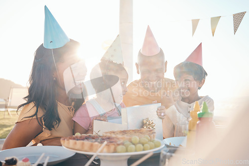 Image of Family, love and happy birthday for girl with wow gift, bonding and laughing, excited and having fun outdoors. Parents, children and kid party outside for cheerful female child with surprise present