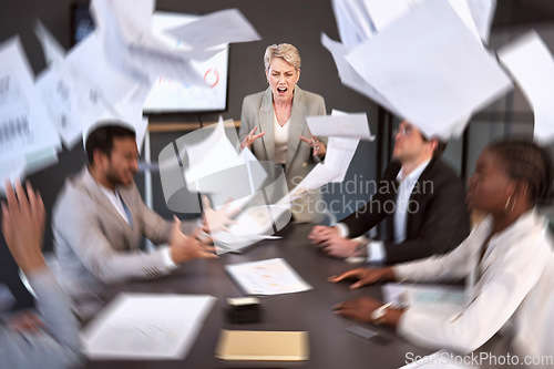 Image of Diversity, woman ceo screaming in anger at colleagues and paperwork in a meeting room at their workplace. Problem, paper and female manager scream at her coworkers with documents falling around