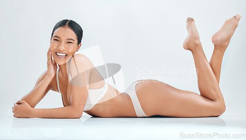 Image of Underwear, beauty and body with portrait of woman in studio for hair removal, skincare and cosmetics. Self care, glow and happy with female model on white background for wellness, natural and shine