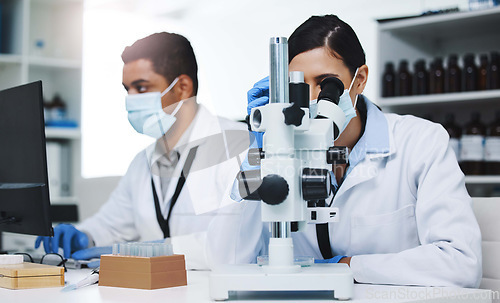 Image of Science, laboratory and team of scientists with microscope for research, medical analysis and lab test. Healthcare, biotechnology and man and woman with equipment for sample, experiment and virus