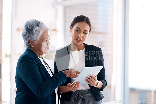 Image of Collaboration, mentor and business women with tablet for talking, cooperation or planning. Technology, teamwork and happy senior manager with female analyst for intern training or coaching in office