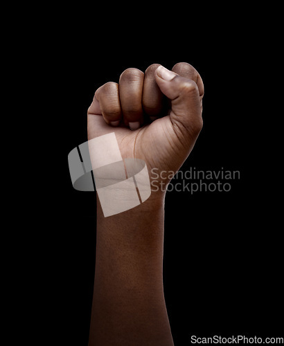 Image of Human rights, protest and hand in fist for justice or solidarity, equality and support for a community. Fight for change, power. and revolution for freedom or empowerment on black or dark background