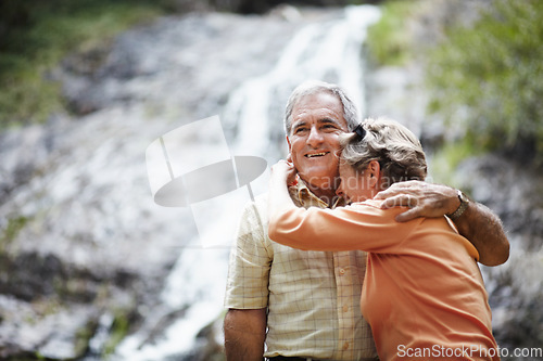 Image of Nature, love and senior couple hug, funny or retirement with relationship, romantic or loving together. Outdoor, old woman or elderly man embrace, natural or laughing with support, bonding or romance