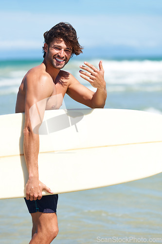 Image of Portrait, surfboard and man at the beach to come for surfing while on summer holiday, vacation and travel in sunshine. Happy male surfer gesture hands for invite, join and freedom to surf at ocean