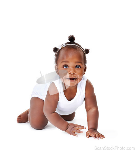 Image of Smile, crawling and African girl baby isolated on white background with playful happiness and growth. Learning to crawl, playing and sitting, face of happy black kid on studio backdrop with childcare