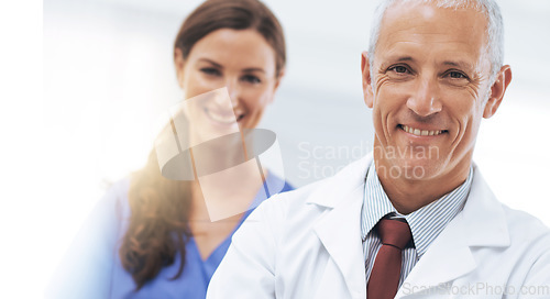 Image of Doctor, man and woman in portrait with arms crossed for health, wellness and team in hospital. Mature healthcare expert, nurse and professional with medical knowledge, leadership and smile in clinic